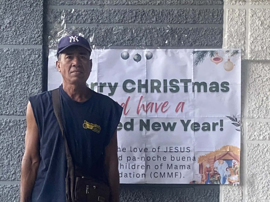 CMMF Noche Buena distribution — a family receiving Christmas aid