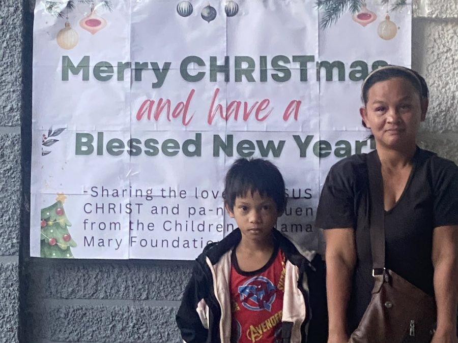 CMMF Noche Buena distribution — a family receiving Christmas aid