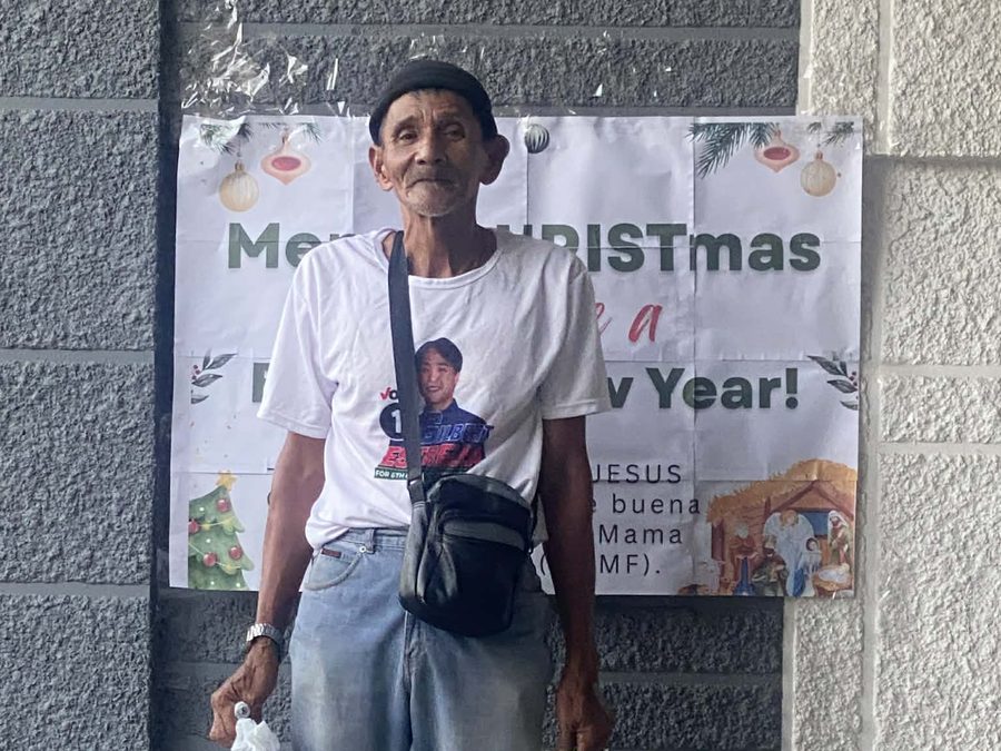 CMMF Noche Buena distribution — a family receiving Christmas aid