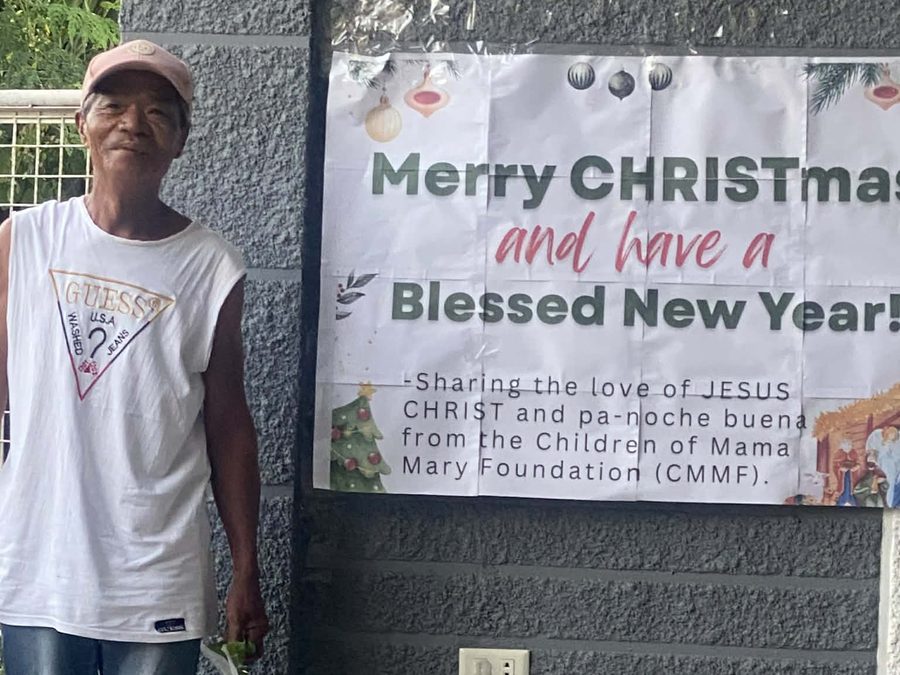 CMMF Noche Buena distribution — a family receiving Christmas aid