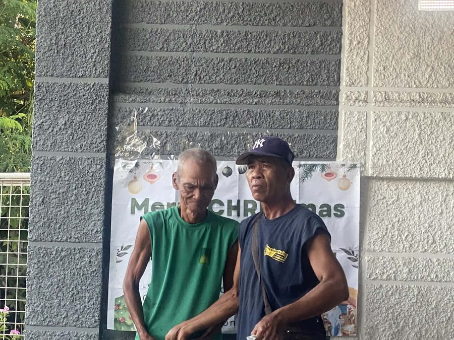 CMMF Noche Buena distribution — a family receiving Christmas aid