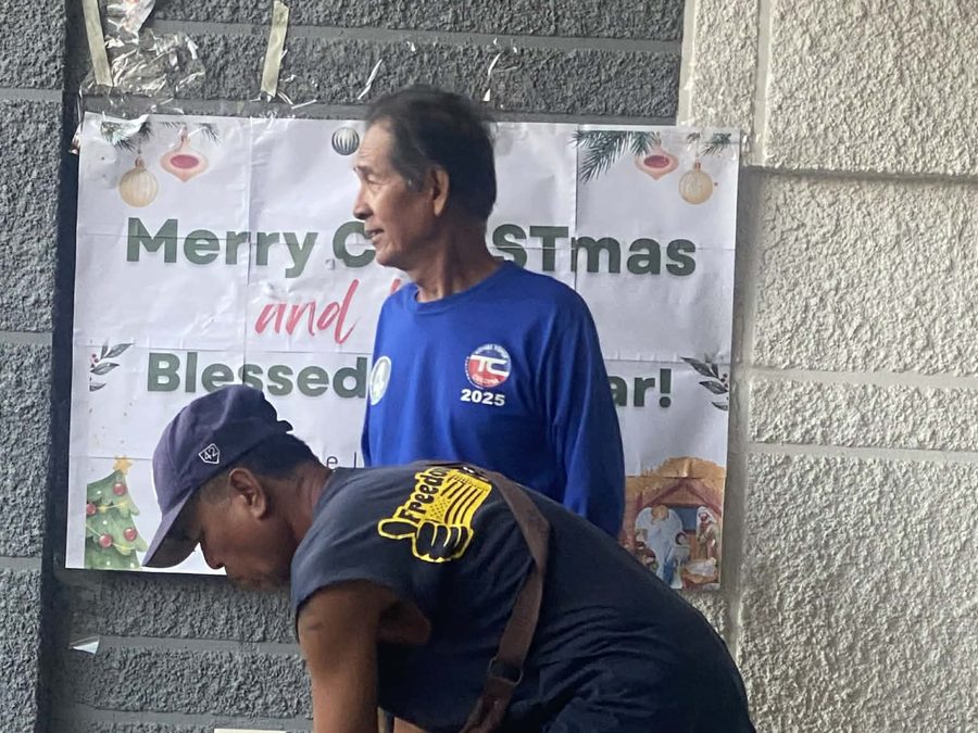 CMMF Noche Buena distribution — a family receiving Christmas aid