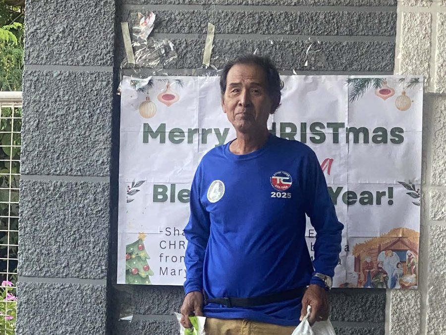 CMMF Noche Buena distribution — a family receiving Christmas aid