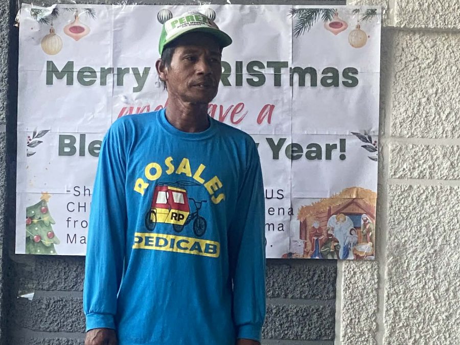 CMMF Noche Buena distribution — a family receiving Christmas aid