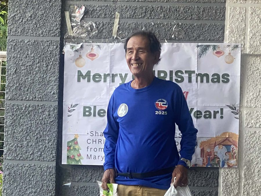 CMMF Noche Buena distribution — a family receiving Christmas aid