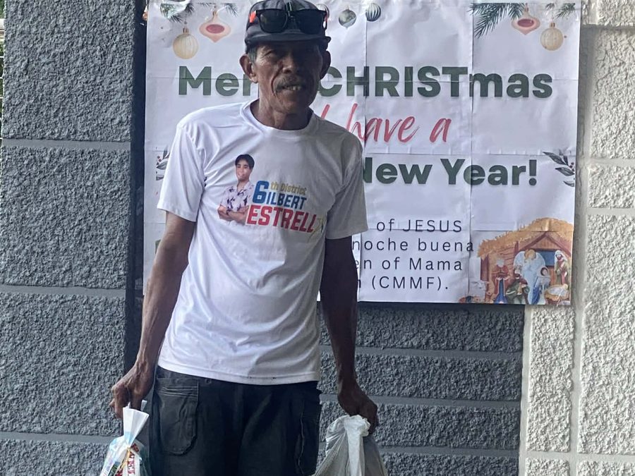 CMMF Noche Buena distribution — a family receiving Christmas aid